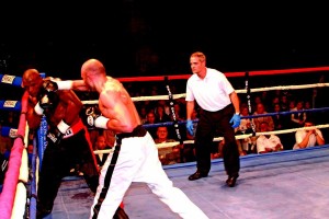 Lockport's Amer Abdallah, center, lands a right hand to the head of Francois Ambang. The referee at right is Joe Pagan. Stephen Wallace/Contributor 