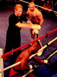 The final moments of Saturday's main event as referee Angelo Castricone, left, steps in.