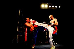 Lockport’s Amer Abdallah, right, delivers a solid leg kick to the head of Scott Muller of Shreveport, La., in a fight last July at the Kenan Center Arena. Abdallah will fight heavyweight Jerald “The Gettoblaster” Johnson of Milwaukee this Saturday night in a professional kickboxing heavyweight main event at the Kenan.