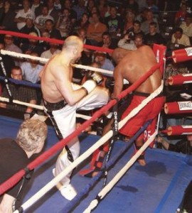 US&J FILE PHOTO Lockport's undefeated pro kickboxer Amer Abdallah, left, pounds away on an opponent in a 2011 WKA fight card at the Kenan Center Arena.