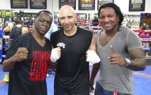 Lockport's Amer Abdallah, center, is flanked by boxing coach Jeff Mayweather, left, and Dewey Cooper after a sparring session this week at the Mayweather Boxing Club in Las Vegas. The undefeated No. 2 world-ranked Abdallah, 16-0, will take on defending world champion Gareth Richards of Wales, United Kingdom, on Saturday night, Nov. 21, for the WKA Light Heavyweight Championship of the World back at the Kenan Arena. It's the Lock City's first-ever world title fight of any kind.