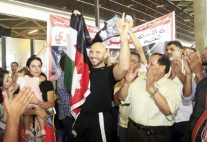 Abdallah is greeted by supporters as he returns to Jordan following his title win.