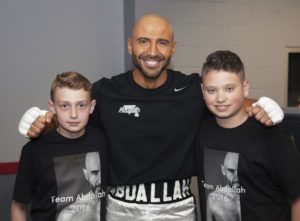 Jat Stoos/Contributor  Abdallah, center, poses with two of his supporters before his world title victory last May.